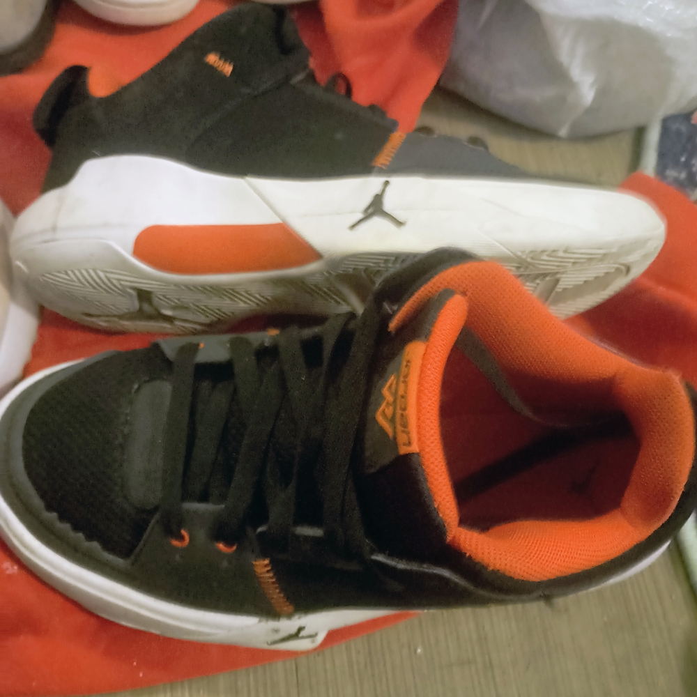 Jordan Red and Black Athletic Shoes with Bold Design